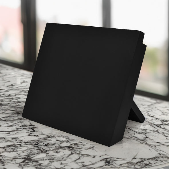 Classica Black Izmir Magnetic Knife Block on top of a marble counter