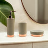 Picture of Natural Concrete set with rose goldtrim in a bathroom, including one Soap Dish, one Toothbrush Holder and one Soap Dispenser
